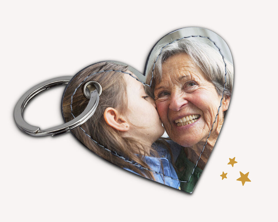 Porte-clés cœur avec deux personnes sur l'image.